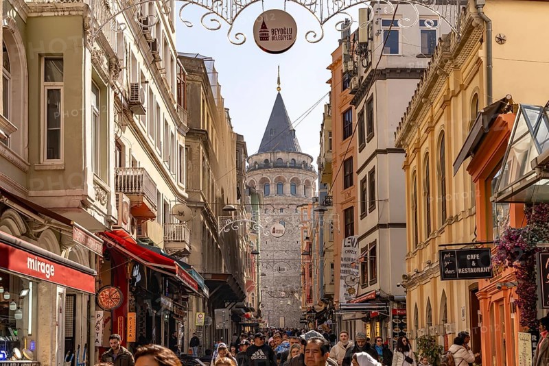 Shops, restaurants and the Galata Tower in Beyoglu, Istanbul, Turkey