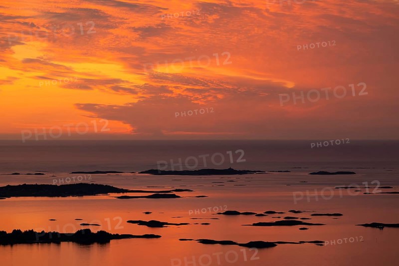 Offshore islands and skerries, sea, dramatically illuminated clouds, sunset, Otroya or Otrøya island, Møre og Romsdal, Norway