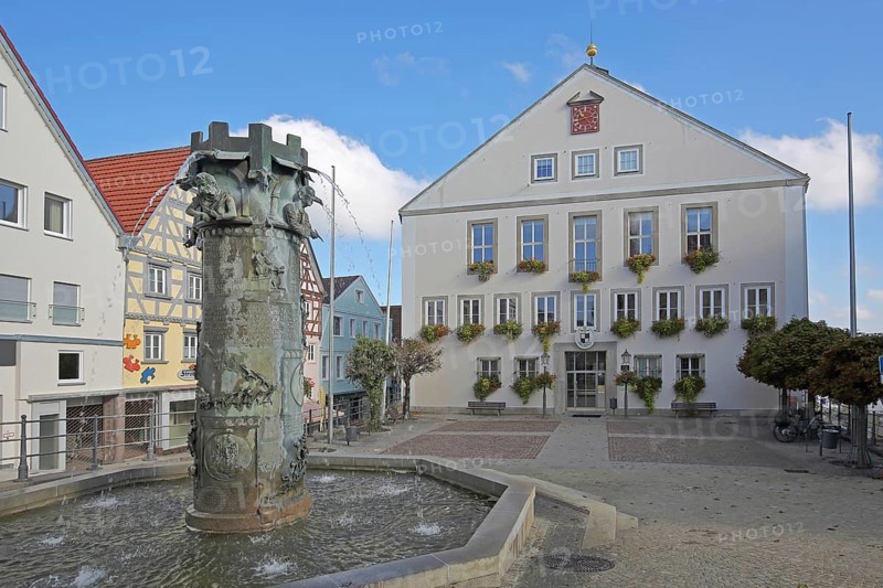 Town hall built in 1958 and town hall fountain with reliefs and figures by Klaus Ringwald 1998, market square, Hechingen, Swabian Alb, Baden-Württemberg, Germany