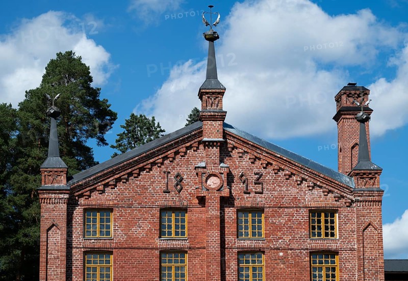 Multi-storey brick façade with inscription 1893, former paper factory and mill for the production of groundwood pulp board, UNESCO World Heritage Site Factory Village Verla, Maailmanperintökohde Verlan puuhiomo ja pahvitehdas, Verla Rapids, Kymenlaakso, near Kouvola, Finland