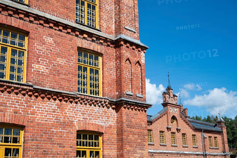 Brick façade with yellow windows, former paper factory and mill for the production of groundwood pulp board, UNESCO World Heritage Site Factory Village Verla, Maailmanperintökohde Verlan puuhiomo ja pahvitehdas, Verla Rapids, Kymenlaakso, near Kouvola, Finland