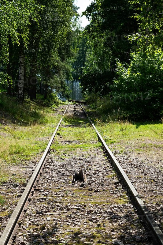 Railway line leads to Lake Väha Kamponen, former paper mill for the production of groundwood pulp board, UNESCO World Heritage Site Verla Factory Village, Maailmanperintökohde Verlan puuhiomo ja pahvitehdas, Verla Rapids, Kymenlaakso, near Kouvola, Finland