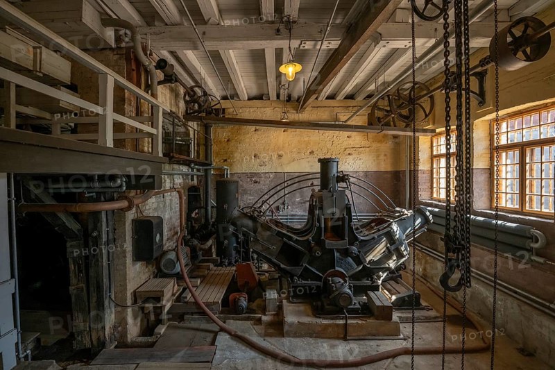 Factory hall with historical machine for the production of cardboard and paper, former paper factory and mill for the production of groundwood pulp board, UNESCO World Heritage Site Verla Factory Village, Maailmanperintökohde Verlan puuhiomo ja pahvitehdas, Verla Rapids, Kymenlaakso, near Kouvola, Finland