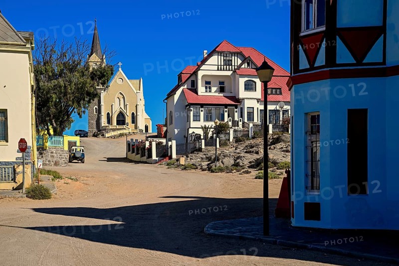 Colonial house facade in the Bergstraße, in the background the rock church, Lüderitz, Karas region, Namibia