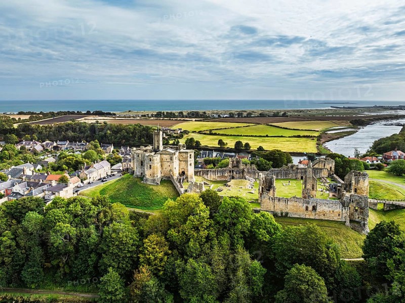 Warkworth Castle over River Coquet from a drone, Warkworth, Northumberland, England, United Kingdom