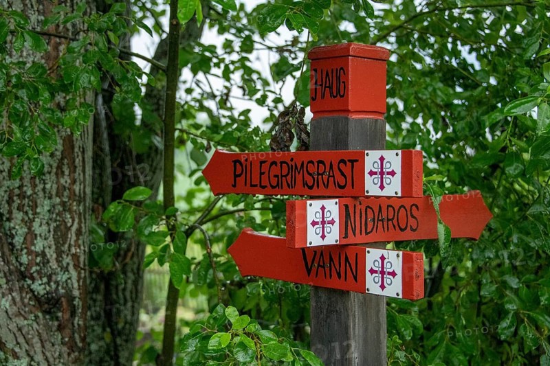 Signpost to Nidaros for pilgrims with the Olav's Cross, Olav's Way or Olavsleden, Eidsvoll, Akershus, Norway