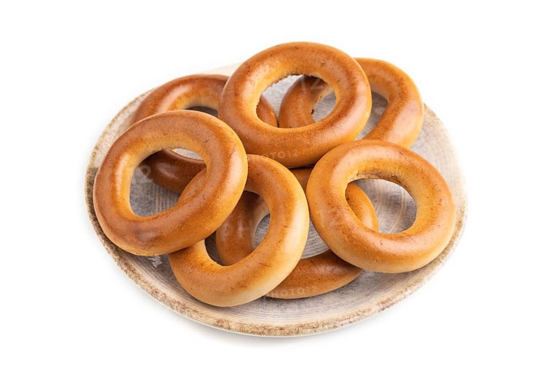 Homemade Ring Bagel isolated on white background. side view, close up