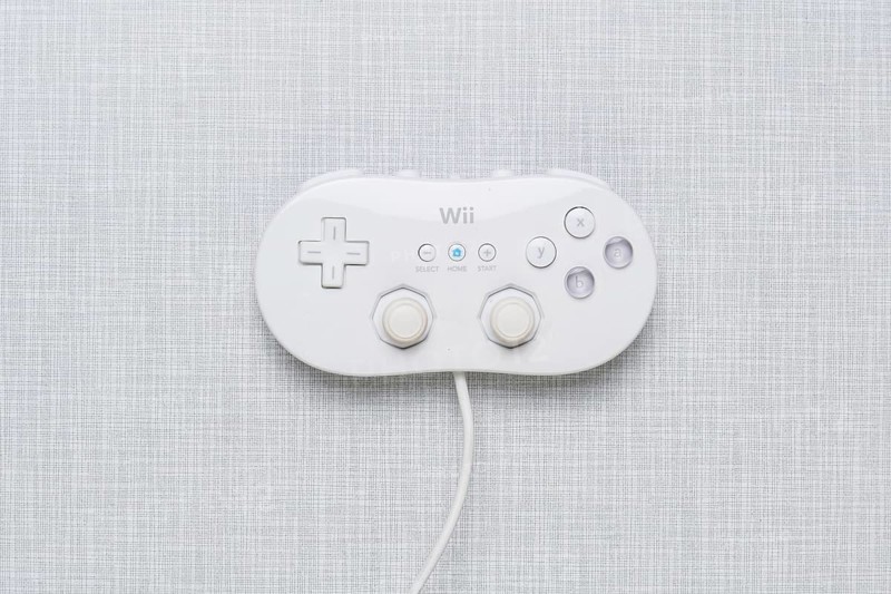 Top shot of a Wii Classic controller on a white Formica plate
