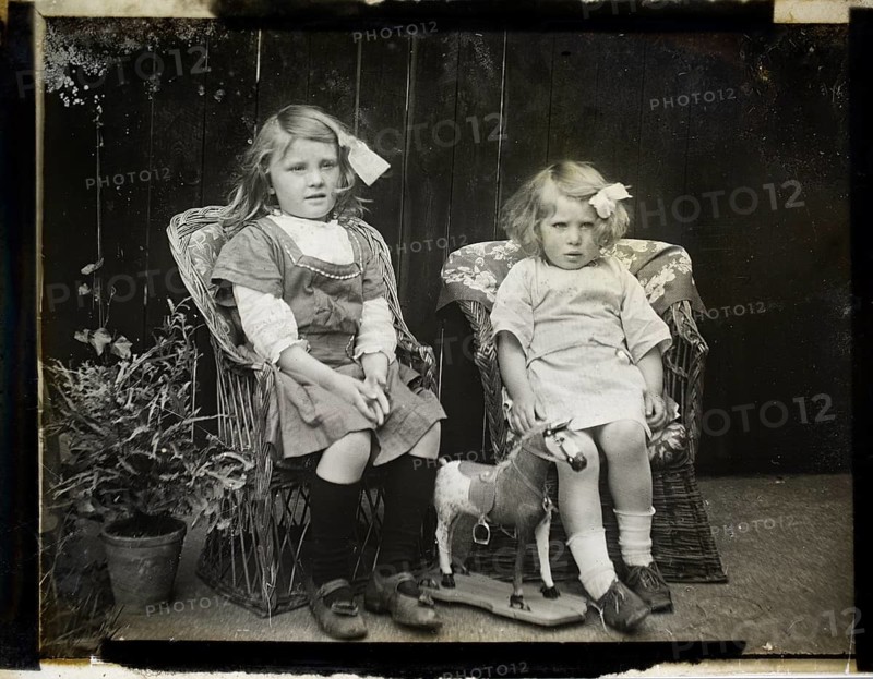 Monochrome magic lantern slide family portrait of two young girls presumably sisters circa 1900