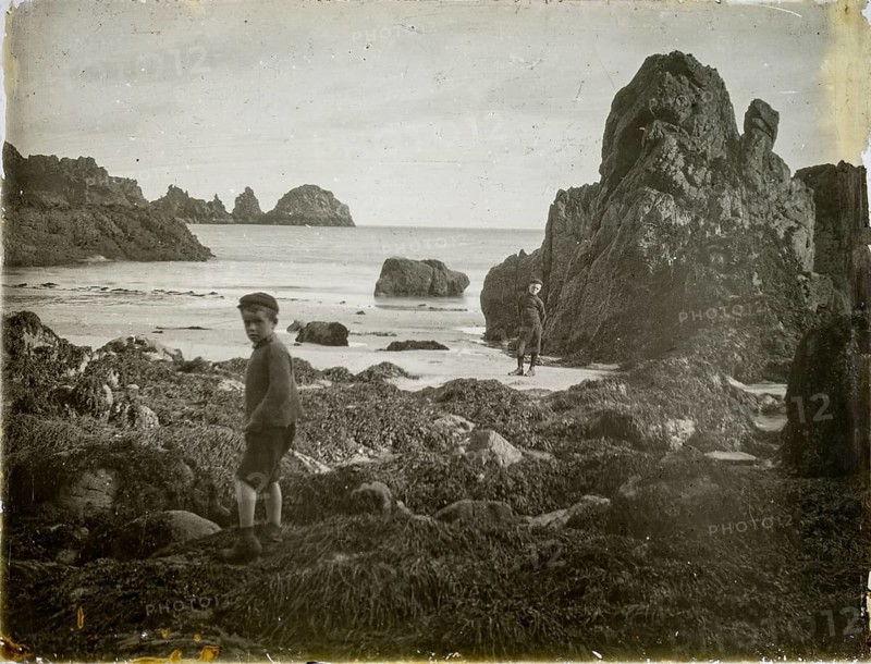 Magic lantern slide two boys playing on rocky beach circa 1900, Moulin Huet Bay, Guernsey, Channel Islands