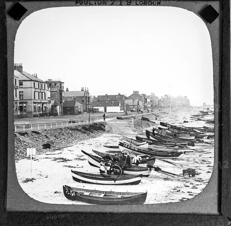 Magic lantern slide by Poulton of boats on the beach in front of Esplanade buildings around the Royal Hotel, Redcar, Teeside, North Yorkshire, England, UK c 1900
