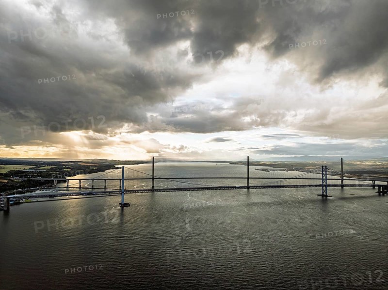 Rain clouds over Forth Road Bridge and The Queensferry Crossing from a drone, Queensferry Crossing, Forth Estuary, Scotland, United Kingdom
