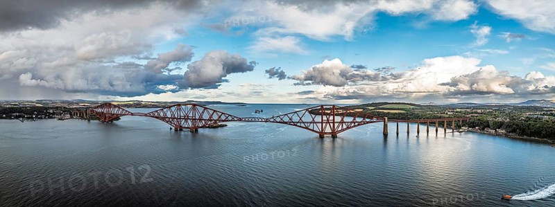 Panorama of Rain clouds over Forth Bridge from a drone, Queensferry Crossing, Forth Estuary, Scotland, United Kingdom