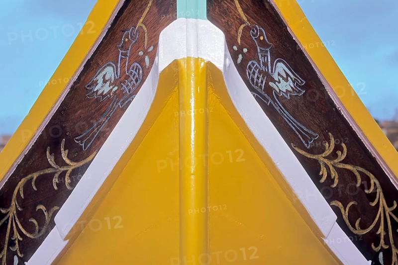 Part of bow of fishing boat with typical colourful painting for Maltese fishing boats, Valletta, Malta