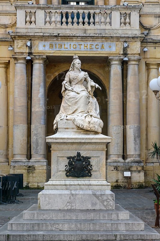 Marble statue of Queen Victoria of Great Britain in front of entrance to National Library of Malta building, Valletta, Malta