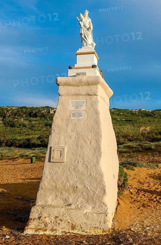 Statue of Madonna Maria Mother of God on Ramla Bay beach, Gozo Island, Malta
