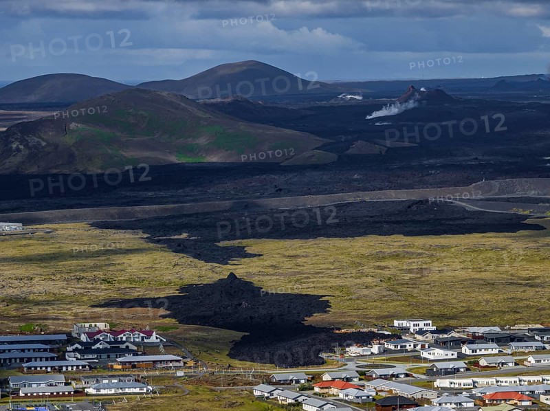 Lava, lava field, village, houses, summer, cloudy, sunny, aerial view, volcanic eruption, July 2025, Grindavik, Sundhnúkur crater series, Fagradalsfjall, Reykjanes, Iceland