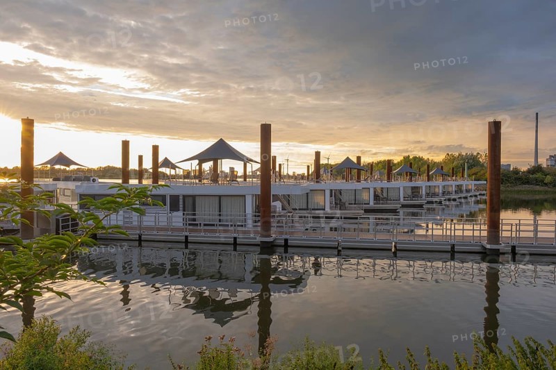 View of house messengers at Lankenauer Höft at Neustadt harbour in the evening light, Weser, Bremen, Germany