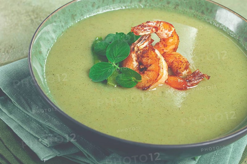 Pea cream soup, with shrimp, green soup, homemade, top view, no people