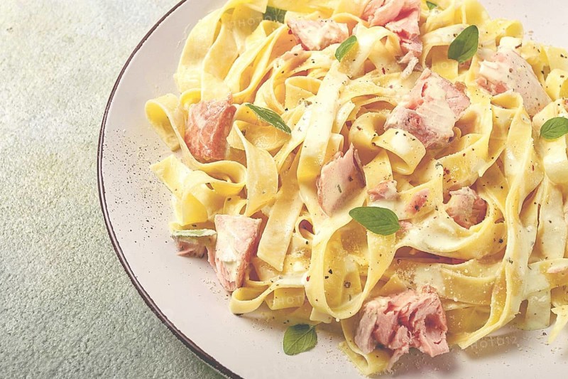 Tagliatelle pasta, in cream sauce with salmon, homemade, no people