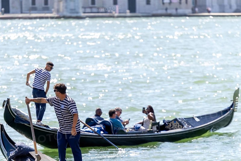 Venice, Italy - 3 September 2025: Gondolier on a gondola in Venice during the 82nd Venice International Film Festival