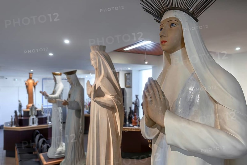 Religious statuettes in museum near Our Lady of Beauraing, Notre-Dame de Beauraing sanctuary, place of pilgrimage at Beauraing, Namur, Belgium