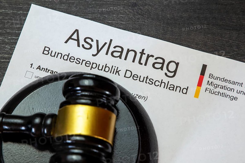 Symbolic asylum application and judge's gavel