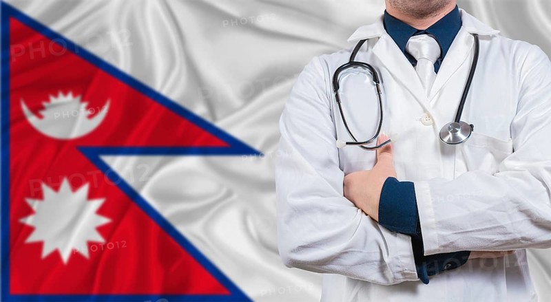Male doctor with stethoscope on Maldivian flag. Doctor holding stethoscope on Maldives flag