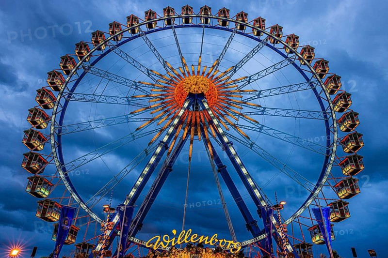 Dark clouds behind the illuminated Ferris wheel, Festwiese, Theresienwiese, Oktoberfest, Munich, Upper Bavaria, Bavaria, Germany
