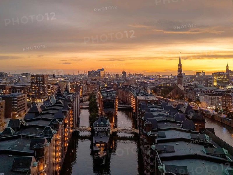 Aerial view of the Speicherstadt Hamburg with evening lighting and view over the harbour with Elbphilharmonie, Hamburg, Germany