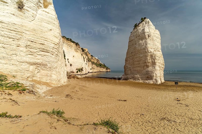 Pizzomunno rock on the Spiaggia di Castello beach in Vieste, Gargano, Apulia, Italy