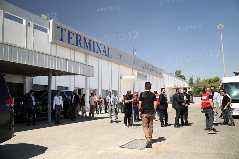 Officials from the Qatari and Syrian Red Crescents receive a Qatari airlift of aid to help the Syrian people, Damascus, Damascus, Syria