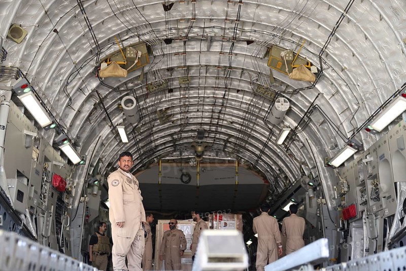 Members of the Qatari Air Force unload humanitarian aid supplies from a transport aircraft at Damascus International Airport as part of Qatar's air and land relief bridge to Syria, Damascus, Damascus, Syria