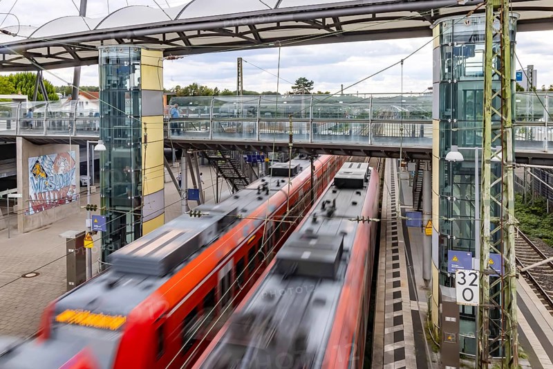 Railway station with passing S-Bahn in Walldorf-Wiesloch. Wiesloch, Baden-Württemberg, Germany