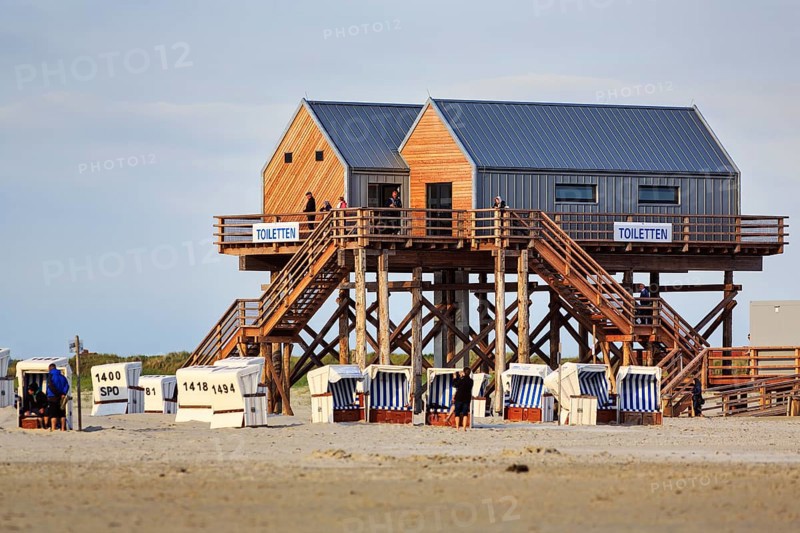 Pile dwelling, toilet house on the beach, beach chairs, strollers, Sankt Peter-Ording, Eiderstedt peninsula, Wadden Sea National Park, North Sea, North Frisia, Schleswig-Holstein, Germany