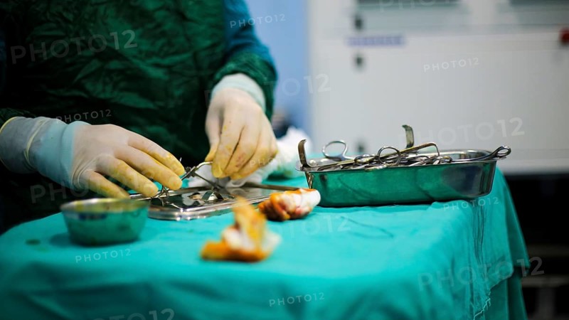 Several doctors performing a complex surgical operation inside an operating room for a displaced patient. Aleppo, Syria. October 18, 2022, Aleppo, Syria