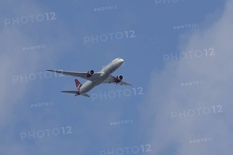 Boeing 787 Dreamliner jet passenger aircraft of Virgin Atlantic airlines in flight in a blue sky, England, United Kingdom