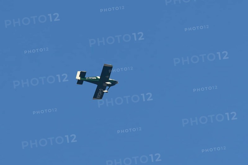 Van's RV-9 light aircraft flying in a blue sky, England, United Kingdom