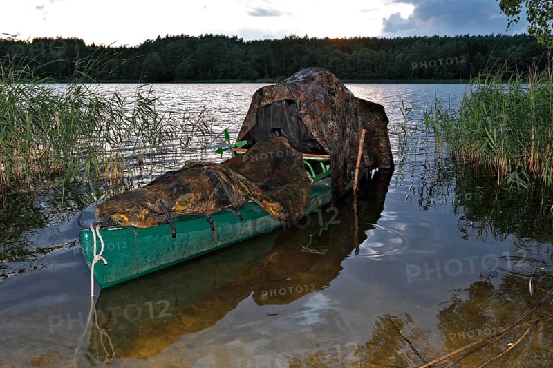 Kayak of a nature photographer in the water, Müritz National Park, Mecklenburg-Western Pomerania, Germany