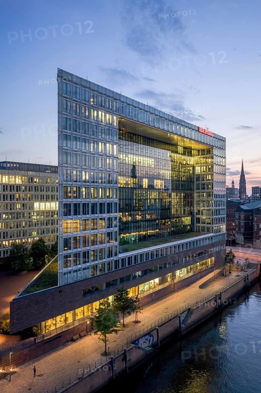 Aerial view of the Spiegel building at Ericusspitze in Hamburg's HafenCity in the Brooktorkai neighbourhood at blue hour, Hamburg, Germany