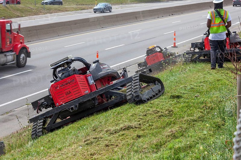 Harper Woods, Michigan - Remote-control mowers are cutting the grass and weeds along Interstate 94 and other freeways running through Detroit. The machines are said to be safer when operating on the steep embankments along most of the city's freeways