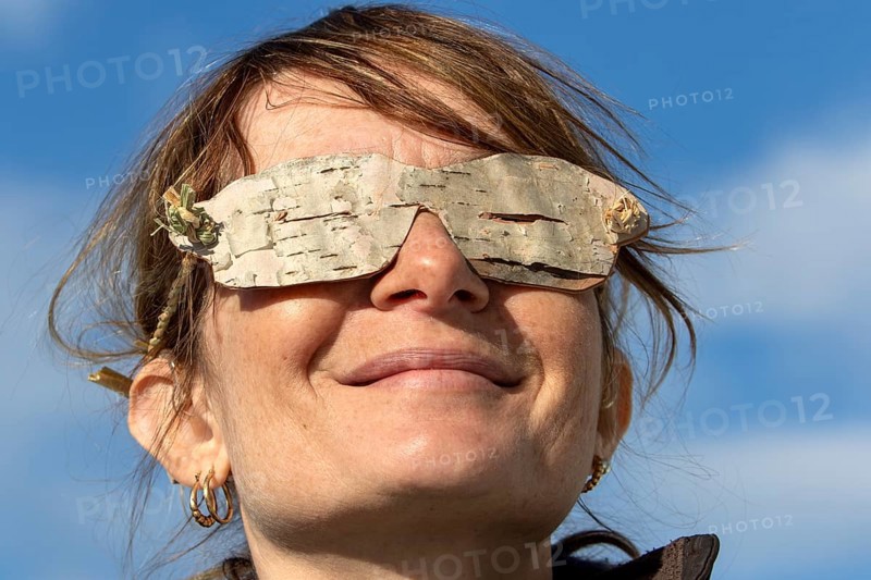 Woman wearing glasses made from birch bark, Gaspesie national park, Province of Quebec, Canada, north America
