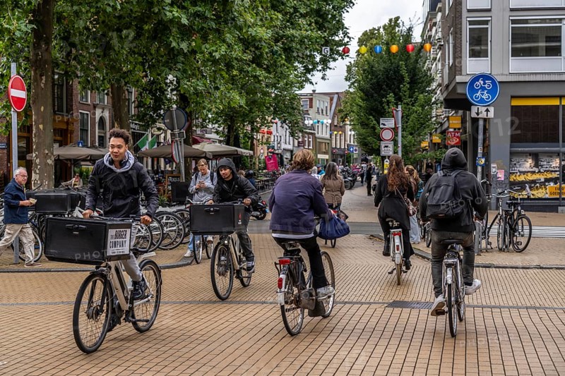 Cycling in the city centre of Groningen, old town, Netherlands