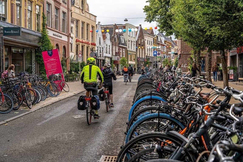 Ride your bike in the city centre of Groningen, old town, designated areas where bikes may be parked, bikes parked outside will be removed, Netherlands