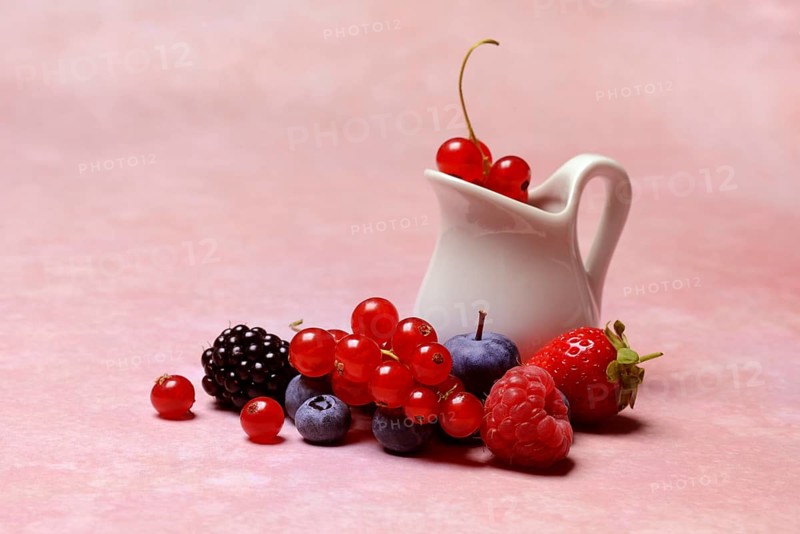 Various fruits with jug, redcurrant, raspberry, strawberry, blueberry, blackberry