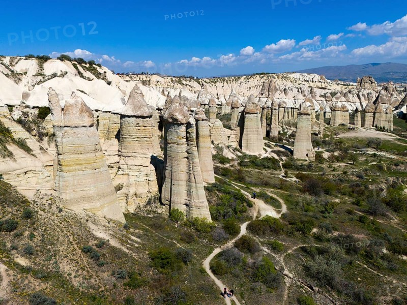 Panorama of imposing rocks and cliffs with a winding path in sunny surroundings, aerial view, Valley of Love, Göreme National Park, Göreme Tarihî Millî Parki, Nevsehir Province, Nevsehir, Cappadocia, Cappadocia, Cappadocia, Cappadocia, Central Anatolia, Turkey