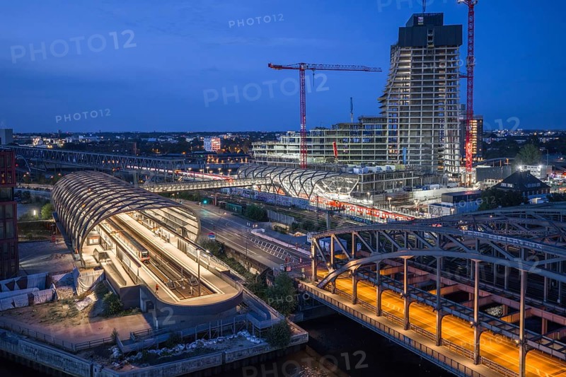 Blue hour aerial view of the Hamburg Elbbrücken U4 underground and suburban railway station and the Elbtower construction site, Hamburg, Germany