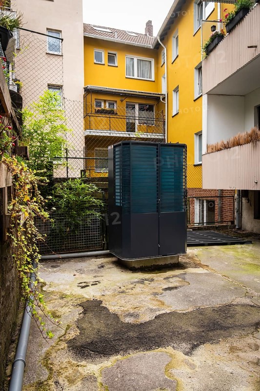 Heat pump in a backyard in Wuppertal, Germany, digitally reworked