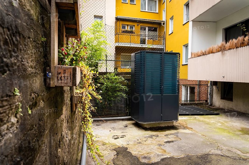 Heat pump in a backyard in Wuppertal, Germany, digitally reworked