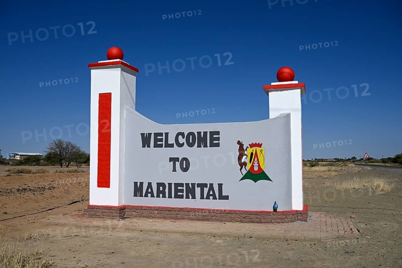 Sign with town coat of arms at the entrance to Mariental, Hardap Region, Namibia